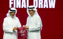 Qatar Football Association president Sheikh Hamad Bin Khalifa Bin Ahmed al-Thani (L) and president of the Asian Football Confederation (AFC) Sheikh Salman bin Ibrahim al-Khalifa at the draw for the AFC Asian Cup