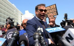US Congressman George Santos speaks to reproters as he leaves Federal Court on May 10, 2023 in Central Islip, New York