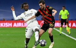 Real Madrid's French midfielder Eduardo Camavinga kept Manchester City's Portuguese midfielder Bernardo Silva (R) quiet