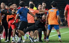 A fight breaks out on the sidelines of the men's final between Thailand and Indonesia