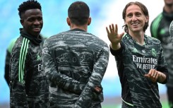 High five: Luka Modric (right) has won five Champions League titles with Real Madrid