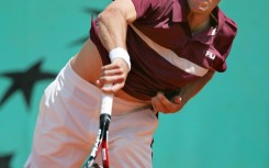 'Sad about the draw': Germany's Lars Burgsmuller returns the ball to Rafael Nadal at the French Open first round in 2005