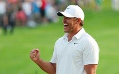 American Brooks Koepka celebrates on the 18th green after winning his fifth major title by capturing the PGA Championship at Oak Hill