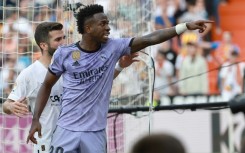 Real Madrid's Brazilian forward Vinicius Junior reacts to being insulted by pointing at a fan he thought was the culprit