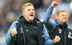 Newcastle manager Eddie Howe celebrates his team's qualification for the Champions League