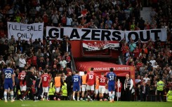 Manchester United fans displayed "Glazers out" banners as they secured a return to Champions League football next season