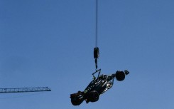 Lewis Hamilton's crashed Mercedes lifted off the track 
