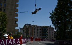 Race marshals remove the car of Mercedes' British driver Lewis Hamilton after he crashed during practice ahead of the Monaco Grand Prix
