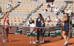 Keeping their distance: Marta Kostyuk (right) and Aryna Sabalenka 