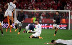 Sevilla's Moroccan forward Youssef En-Nesyri (C) celebrates his team's  qualification for the Europa League final