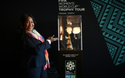 FIFA Secretary General Fatma Samoura poses next to the Women's World Cup trophy