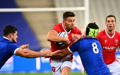 Wales scrum-half Rhys Webb (C) has retired from Test rugby