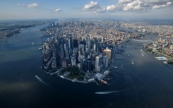 An aerial view shows the skyline of lower Manhattan, New York city on August 5, 2021