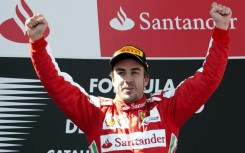 Remember me? Fernando Alonso celebrates victory at the 2013 Spanish Grand Prix in his Ferrari days