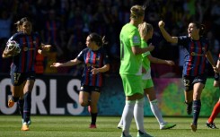 Barcelona midfielder Patri Guijarro (R) celebrates after scoring one of her two goals in her team's triumph in Eindhoven