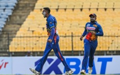 Sri Lanka's Dushmantha Chameera (L) celebrates after taking a wicket 