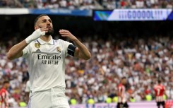 Real Madrid's French forward Karim Benzema celebrates scoring a goal from the penalty spot against Athletic Bilbao