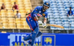 Sri Lanka's Dimuth Karunaratne plays a shot during the third and final one-day international cricket match between Sri Lanka and Afghanistan