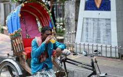 With more people staying home to avoid the heat, vendors and rickshaw operators are seeing fewer customers