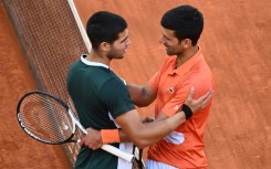 New era? Carlos Alcaraz (left) after defeating Novak Djokovic in the Madrid Open semi-finals in 2022