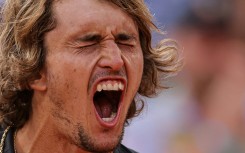 No more pain: Alexander Zverev shouts as he celebrates his victory over Argentina's Tomas Martin Etcheverry 