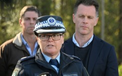 The driver was arrested but no charges have been laid so far, said Acting Assistant Commissioner Tracy Chapman (C, with NSW Premier Chris Minns, R) 