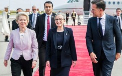 Tunisian Prime Minister Najla Bouden, at the centre,  welcomes European Commission head Ursula von der Leyen and Dutch Prime Minister Mark Rutte, on the right