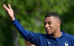 Paris Saint-Germain's France forward Kylian Mbappe attends a training session ahead of the upcoming UEFA Euro 2024 qualifying matches