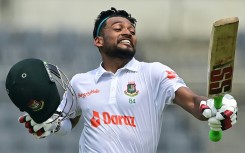 Bangladesh batter Najmul Hossain celebrates after scoring a century on the first day of the one-off Test against Afghanistan at the Sher-e-Bangla National Cricket Stadium in Dhaka