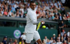 Australia's Nick Kyrgios with a white sleeve at Wimbledon in 2019 to cover up evidence of self-harm