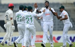 Bangladesh's Ebadot Hossain (2R) celebrates with teammates after the dismissal of Afghanistan's Abdul Malik