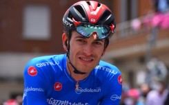Switzerland's Gino Mader wearing the best climber's blue jersey prior to the start of the seventh stage of the Giro d'Italia in 2021