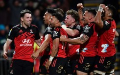 The Crusaders celebrate after a try by Leicester Fainga'anuku (second from left) in Friday's Super Rugby Pacific semi-final win over the Blues