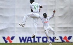 Bangladesh's Shoriful Islam (L) celebrates after the dismissal of Afghanistan's Afsar Zazai