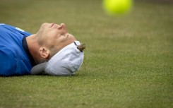 Take it lying down: Tallon Griekspoor celebrates