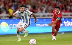 Nicolas Ivan Gonzalez and Asnawi Mangkualam Bahar contest the ball during Argentina's 2-0 friendly win over Indonesia in Jakarta