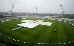 Ground staff cover the field as rain stops play in the first Ashes Test at Edgbaston