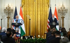 India’s Prime Minister Narendra Modi waves alongside US First Lady Jill Biden during a visit to the National Science Foundation in Alexandria, Virginia, on June 21, 2023, the day before Modi is honored with a state dinner