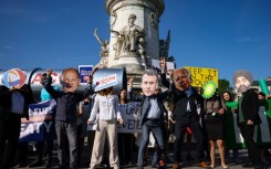 Protesters gathered on the streets of central Paris Friday morning in a rally against fossil fuels
