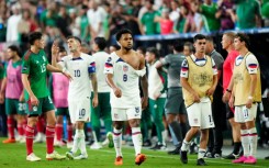 Weston Mckennie of the United States walks with a torn jersey following his scuffle in the second half of a CONCACAF Nations League semi-final against Mexico