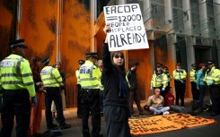Protesters threw paint on the headquarters of TotalEnergies in London