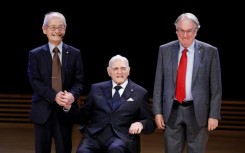 John Goodenough (C) shared the 2019 Nobel Prize in Chemistry for developing the lithium-ion battery with Akira Yoshino (L) and Stanley Whittingham