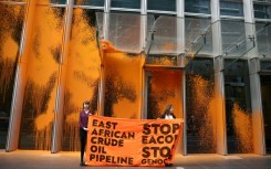 Campaigners targeted the UK headquarters of TotalEnergies with paint to protest a pipeline bringing crude oil to the Tanzanian coast through several protected nature reserves
