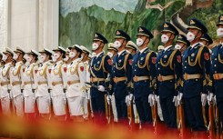 Chinese honor guards take formation at the Great Hall of the People in Beijing on June 28, 2023 