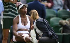 Venus Williams receives medical attention during her Wimbledon first-round match against Ukraine's Elina Svitolina 