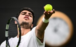 Spain's Carlos Alcaraz serves to France's Jeremy Chardy at Wimbledon