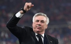 Real Madrid's Italian coach Carlo Ancelotti gestures as he celebrates his team's victory during the UEFA Champions League final in May 2022