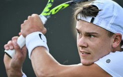 Back to front: Denmark's Holger Rune taking on Britain's George Loffhagen at Wimbledon on Wednesday
