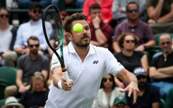 Senior service: Stan Wawrinka returns the ball to Argentina's Tomas Martin Etcheverry 