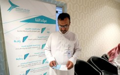 Saudi physician Hamad al-Sheehan reads a leaflet at a Riyadh clinic that treats narcotics addiction in June 2023
